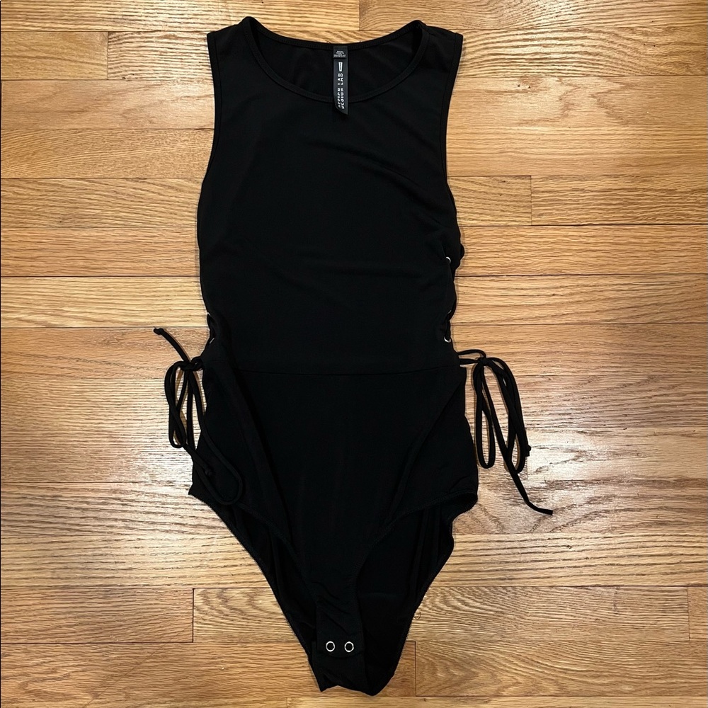 Black bodysuit with tie detailing. Design Lab size M